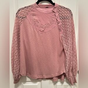 Buckle rose colored long  sleeves. Size Large. The color can be worn two ways.